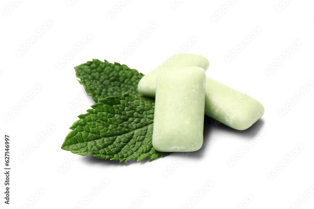 Fresh chewing gums with mint on white background