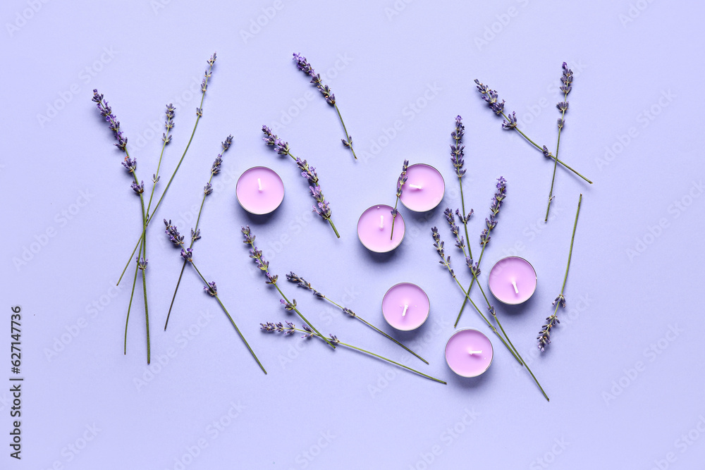 Composition with candles and lavender flowers on color background