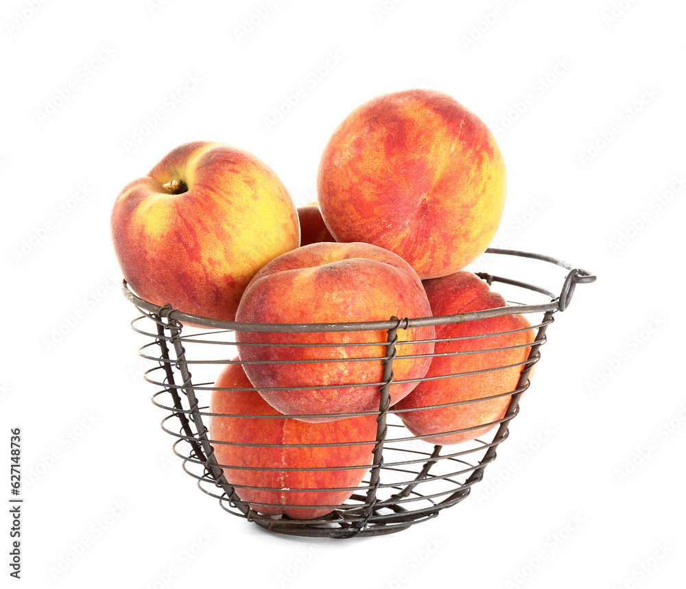 Basket with sweet peaches on white background