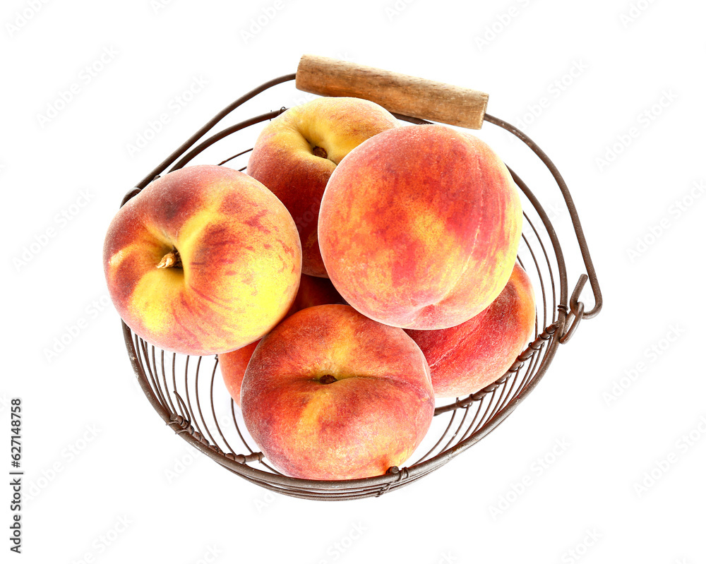 Basket with sweet peaches on white background