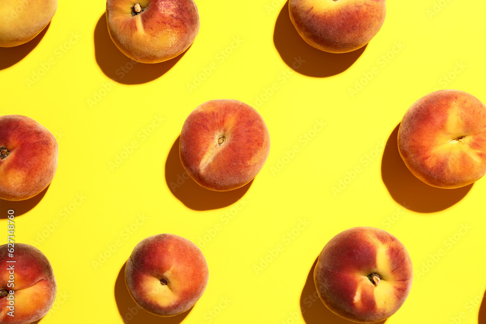 Many sweet peaches on yellow background