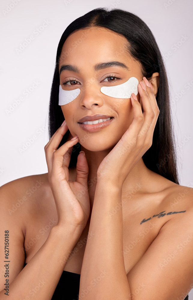 Happy woman, portrait and eye mask for skincare, collagen or dermatology against a grey studio backg