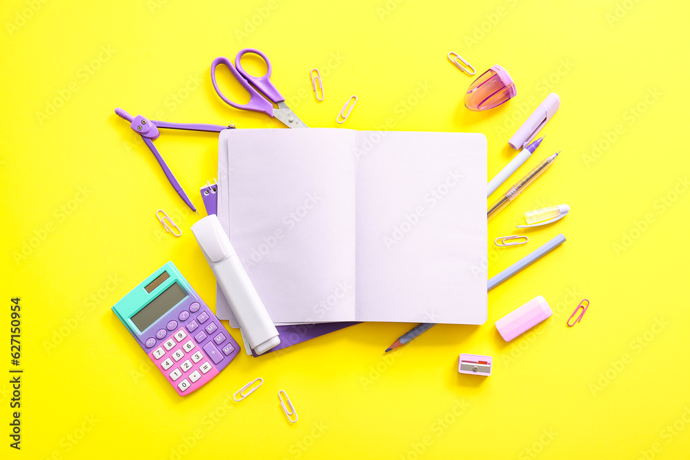 Composition with blank notebook and school stationery on yellow background