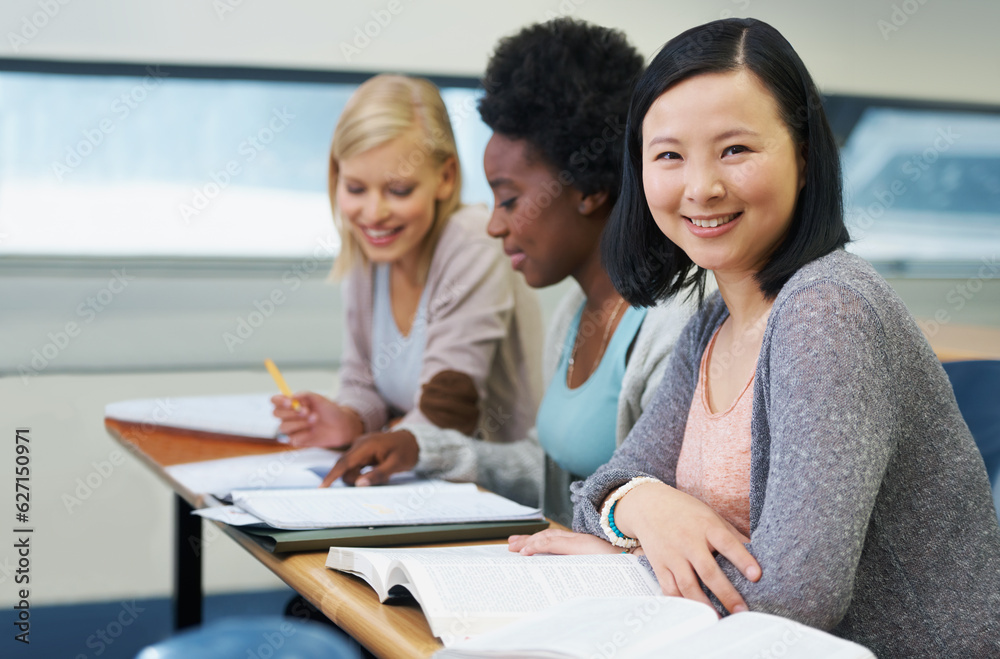 Her education is important to her. A group of students sitting in an exam room.