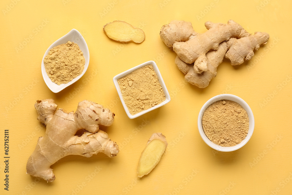 Fresh ginger roots and bowls with dried powder on yellow background