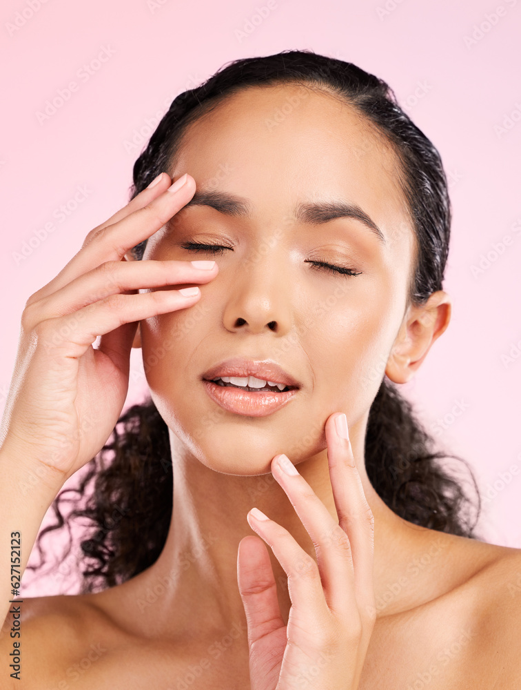 Skin, beauty and hands on face of a woman in studio for cosmetics, dermatology and glow. Headshot, m