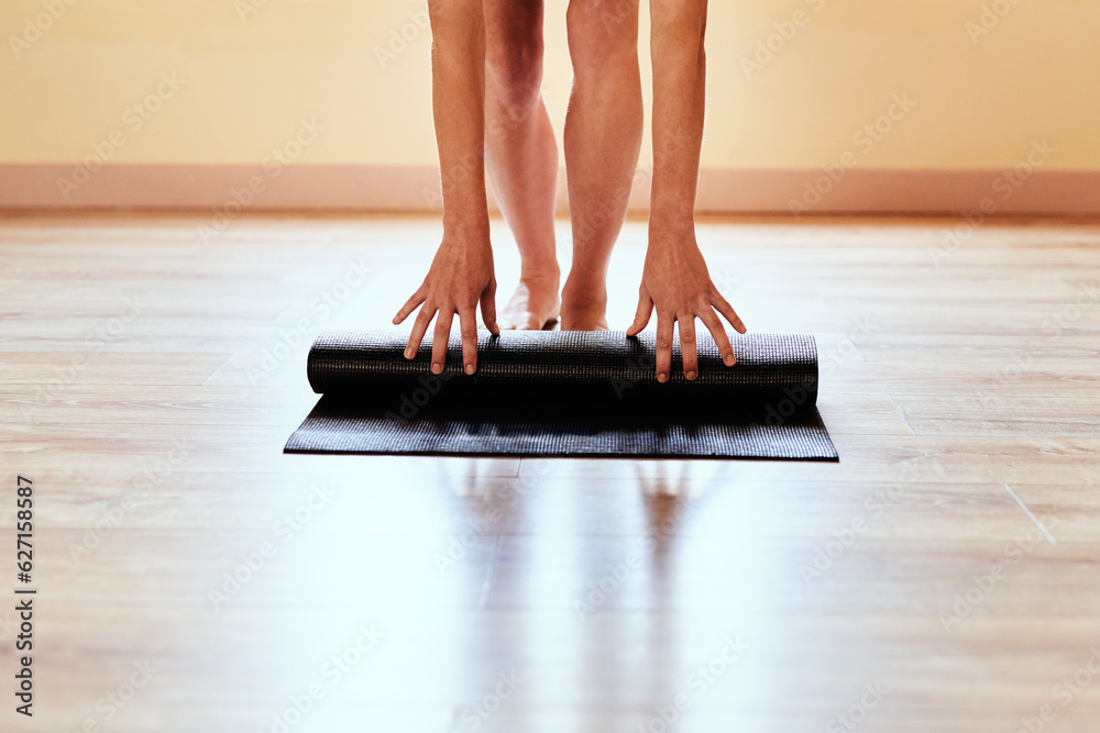 The journey to self improvement starts today. Cropped shot of a woman rolling out her yoga mat.