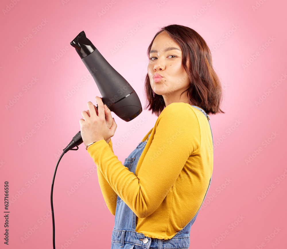 Hairdryer, kiss and hair care with portrait of woman in studio for hairdresser, beauty and cosmetics