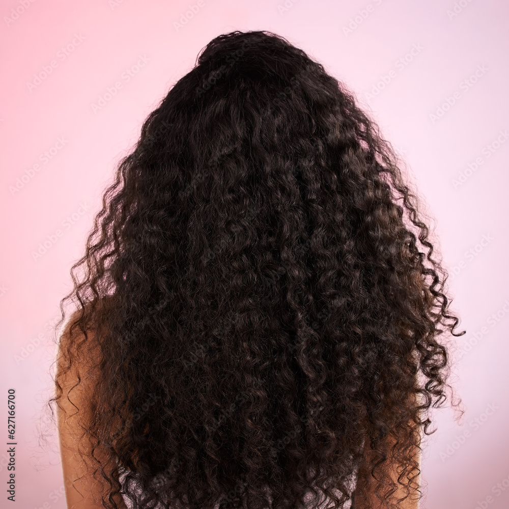 Woman, back and healthy hair in studio for wellness, cosmetics and growth by pink background. Girl, 