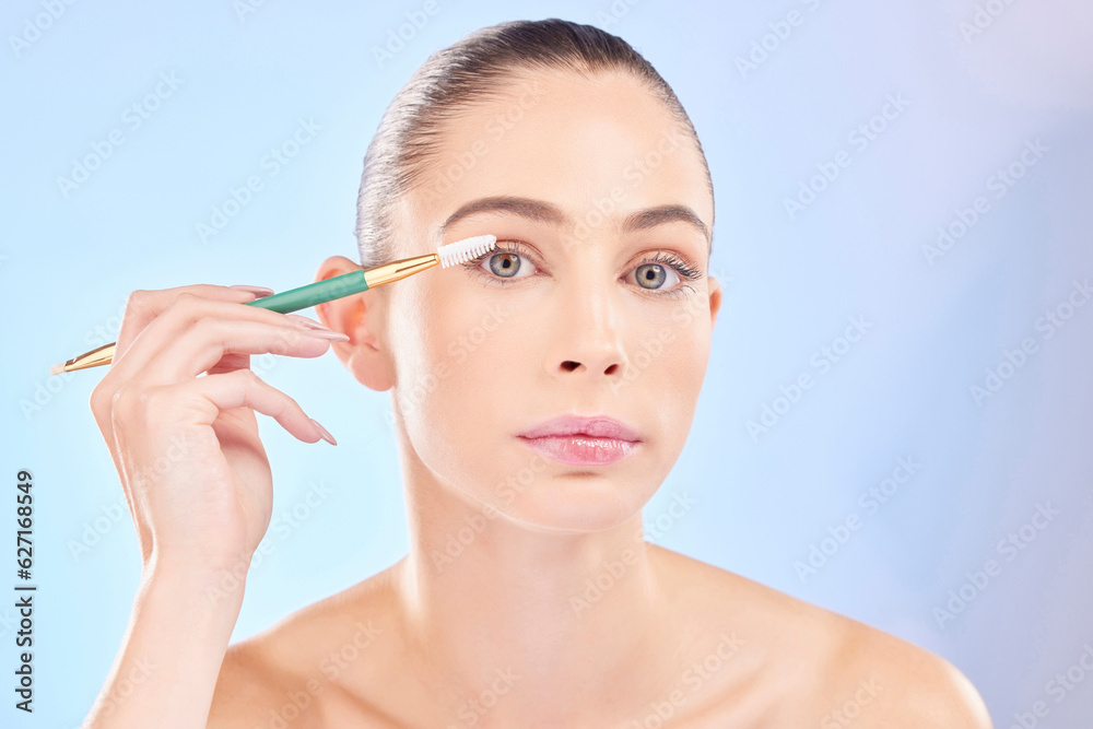 Makeup, portrait and woman with brush on eyes on blue background for cosmetics and skincare. Mascara