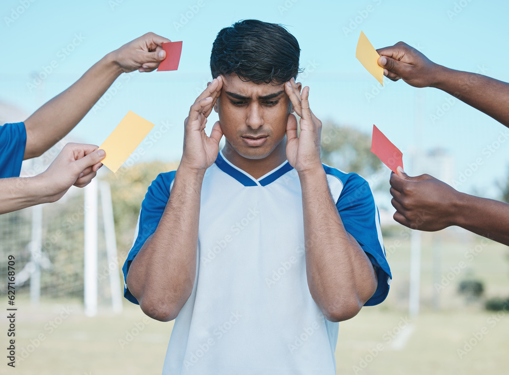 Hands, card and a man with headache from soccer, fitness stress and warning on the field. Sports, bu