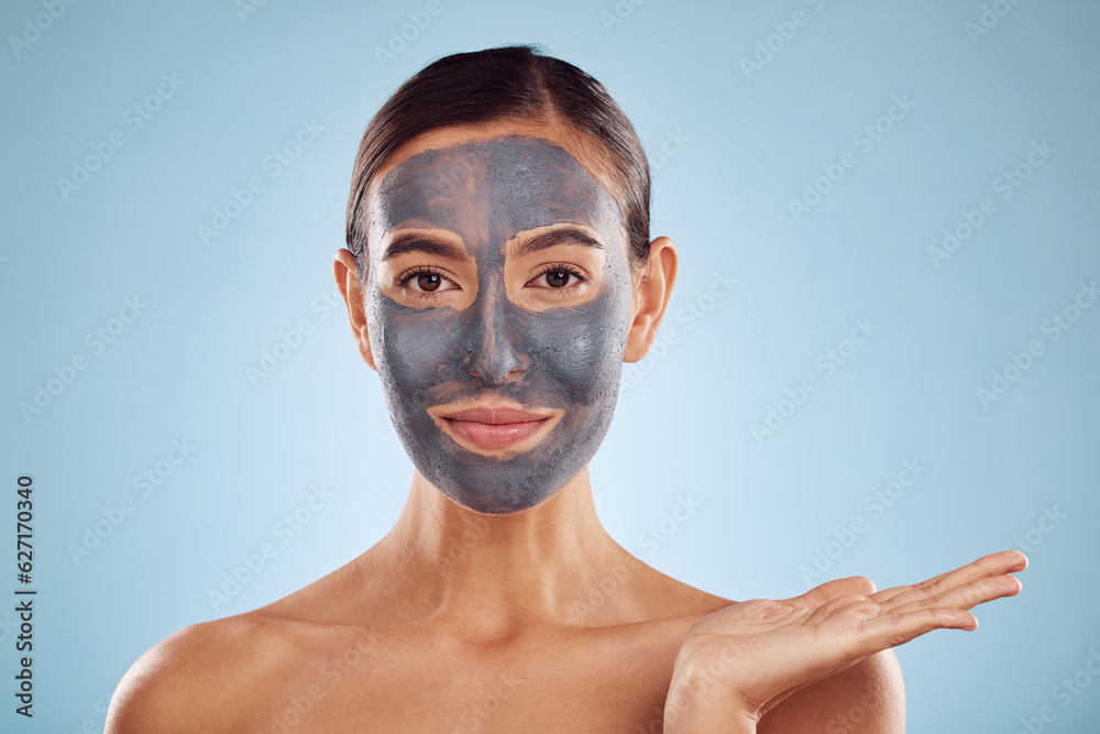 Face mask, skincare and beauty of woman showing facial product isolated in blue studio background. S