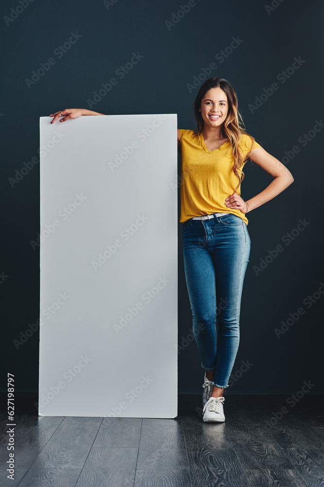 Because sharing is caring. Shot of a handsome young man standing next to a blank placard.