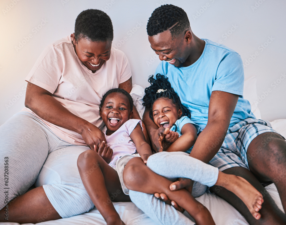 Happy, laugh and black family on a bed with games, tickle and bonding in a home on the weekend. Love