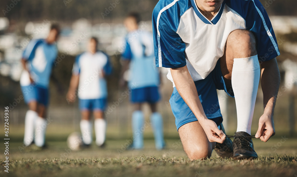 Tie, man or soccer player with shoes on football field in training, exercise or workout in Brazil. L