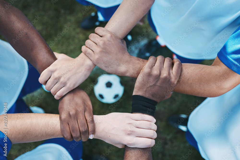 Sports, teamwork and support with hands of soccer player on field for fitness, support and community