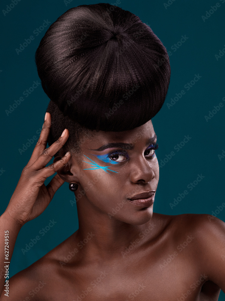 Portrait, beauty and hair with an african woman in studio on a blue background for makeup or cosmeti