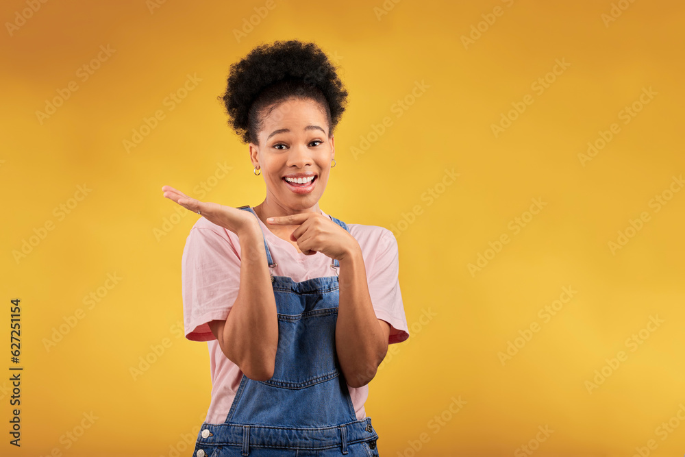 Portrait, marketing and a black woman pointing to her palm for the promotion of a product on a yello