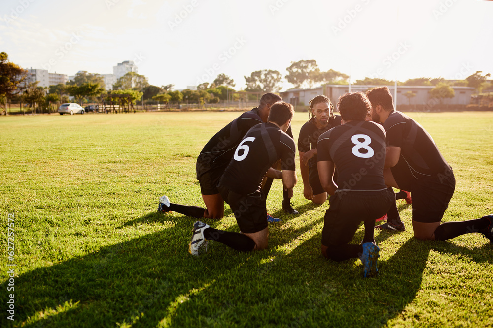 We have to win. Full length shot of a diverse group of sportsmen crouching together before playing r