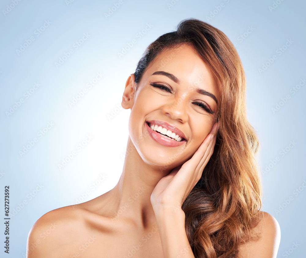 Happy woman, portrait and face in skincare for beauty, haircare or cosmetics against a blue studio b