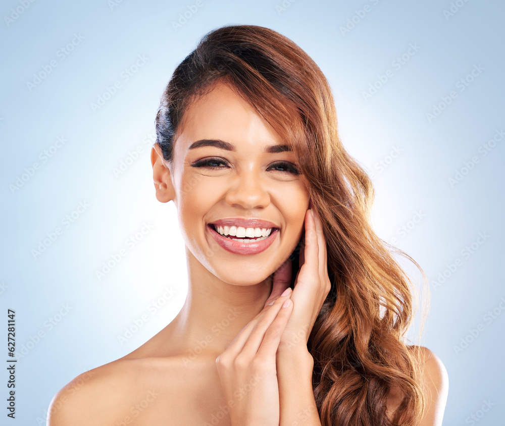 Happy woman, portrait smile and skincare for beauty, haircare or cosmetics against a blue studio bac