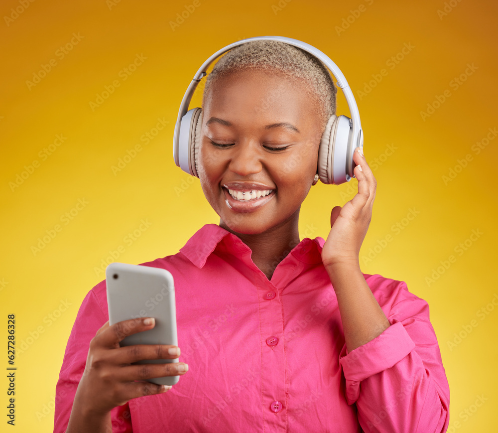 Happy, phone and black woman with music headphones in studio for streaming, track or selection on ye