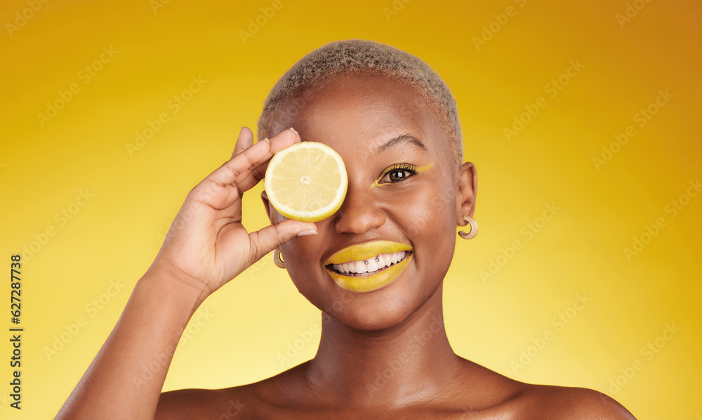 Happy black woman, portrait and lemon for vitamin C or natural beauty against a yellow studio backgr