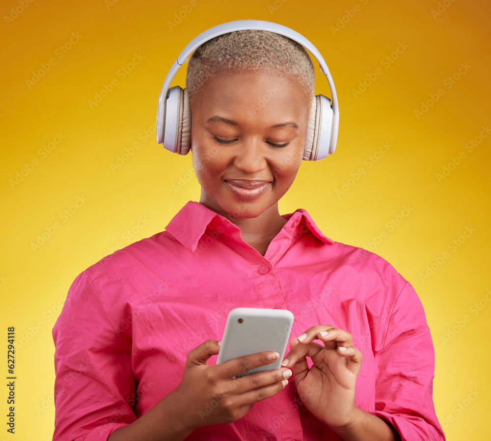 Phone, smile and black woman with music headphones in studio for streaming, track or selection on ye