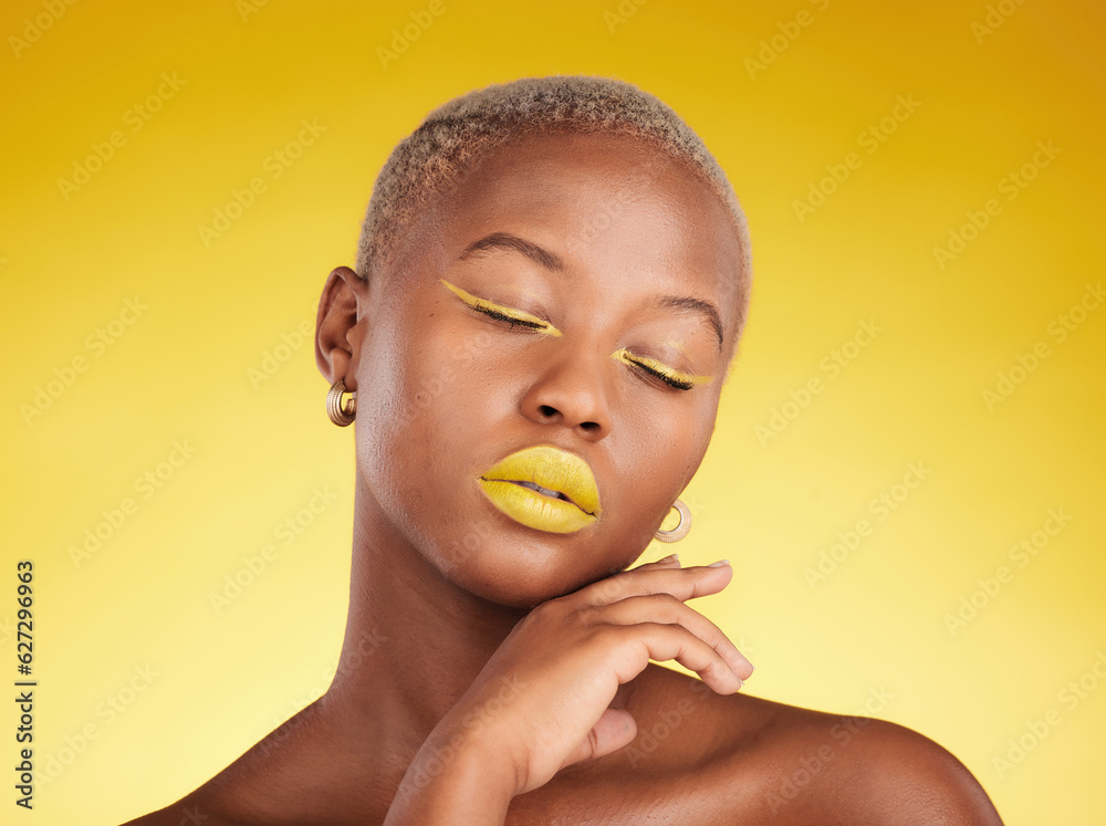 Face, makeup and lipstick with a black woman in studio on a yellow background for creative, beauty o