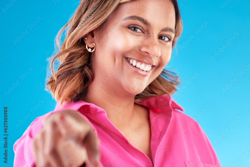 Woman, pointing finger and smile portrait in studio for beauty, advertising and choice. Face of a ha