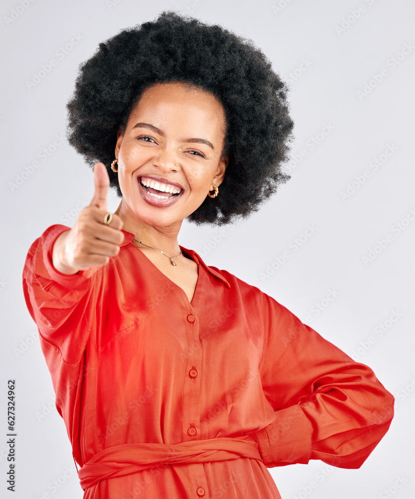 Thumbs up, smile and portrait of a businesswoman in studio with success, achievement or goal. Happin