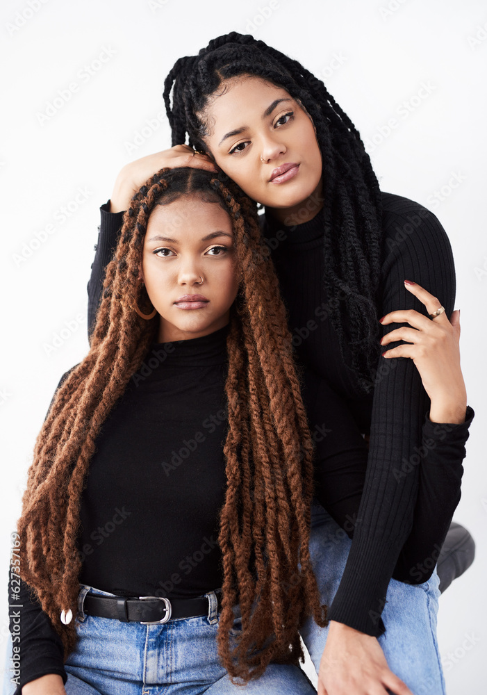 Together they inspire beauty. Studio shot of two beautiful young women posing against a grey backgro