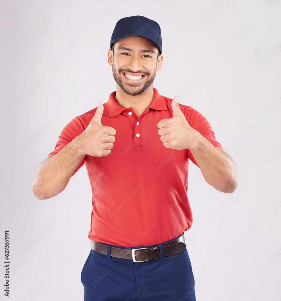 Thumbs up, smile and portrait of a happy man in studio with a hand sign for support or thank you. A 