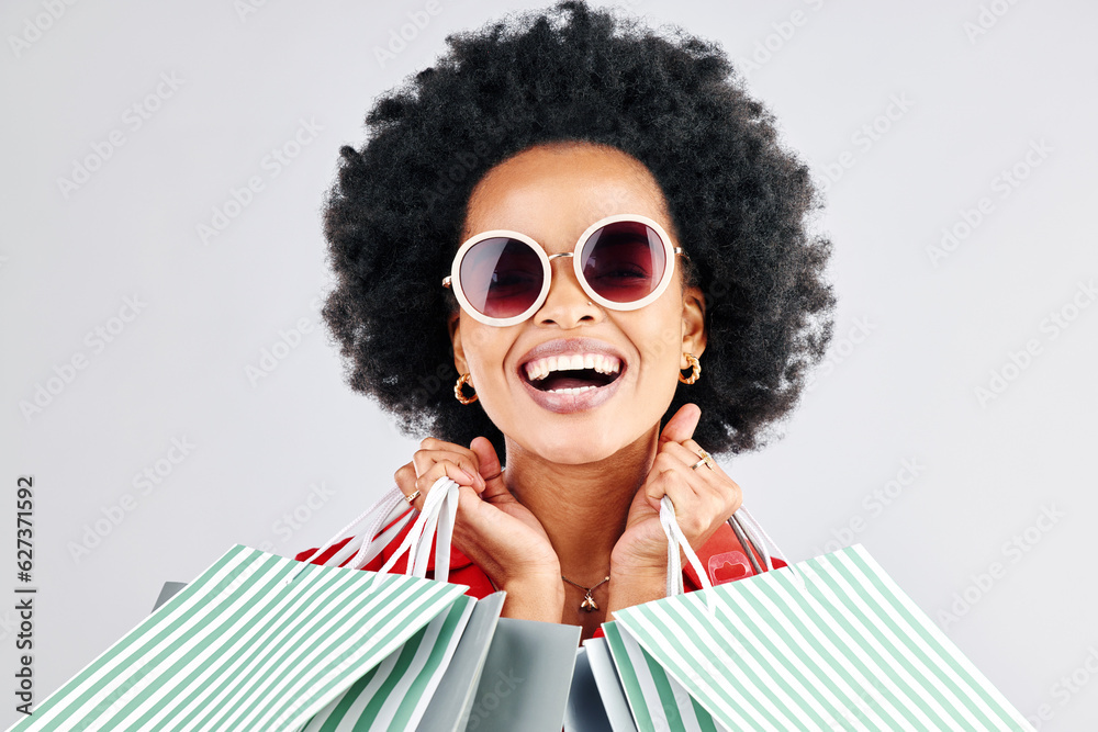 Happy black woman, face and shopping bags for fashion or style against a white studio background. Po