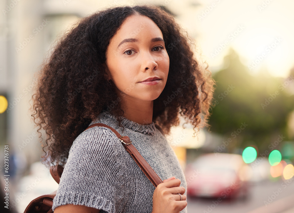 .Young, serious and portrait of a woman in the city waiting for a cab, lift or public transport. Bea