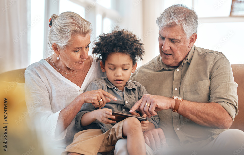 Grandparents, phone and child in home pointing, learning and bonding together in living room. Smartp