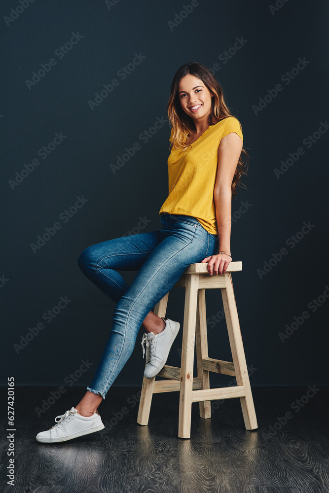 I enjoy the simple things in life. Studio shot of an attractive young woman against a dark backgroun