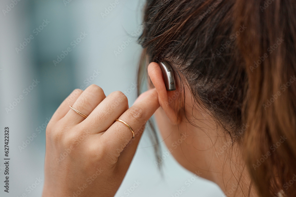 Hearing aid, closeup and ear of woman with disability from the back for medical support, listening o