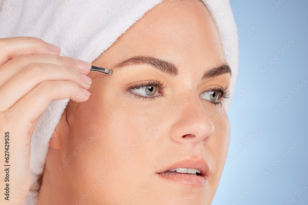 Face, beauty and woman with tweezers for eyebrow in studio, blue background and aesthetic change. Cl