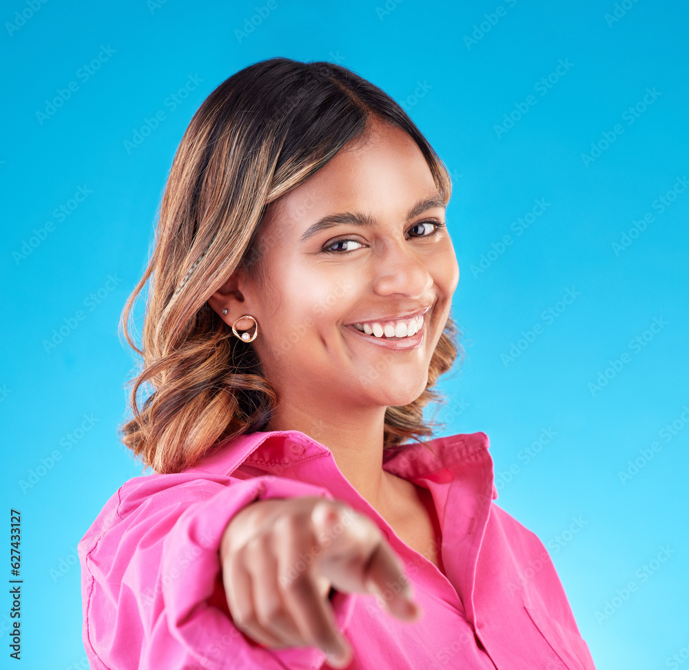 Pointing finger, smile and portrait of woman in studio to select, advertising or choice. Face of hap