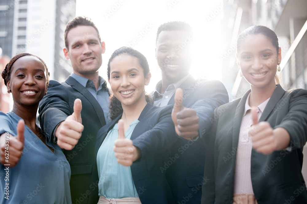 Diversity, portrait of businesspeople and thumbs up smiling in a city background with a lens flare. 