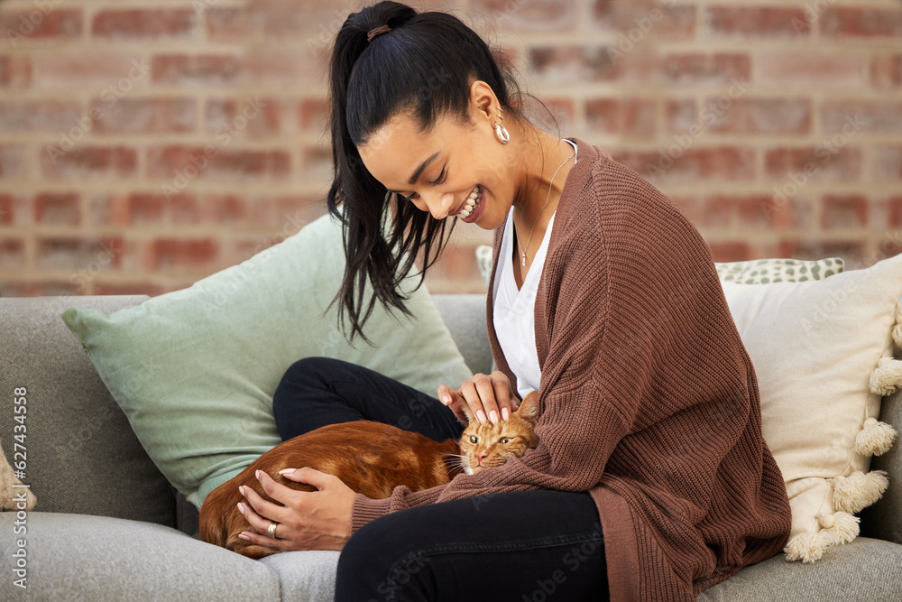 Love, woman with her cat and on a sofa in living room of her home sitting. Animal care or support, q