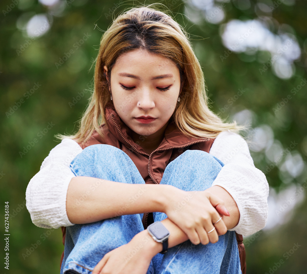 Student, depression and thinking with woman in park for sad, college and anxiety. Mental health, psy