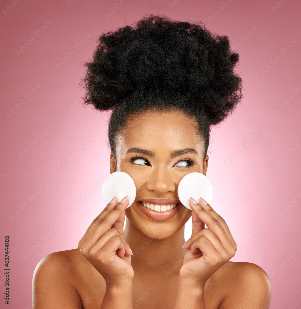 Black woman, cotton pad and skincare with makeup, dermatology and facial on a studio background. Fem