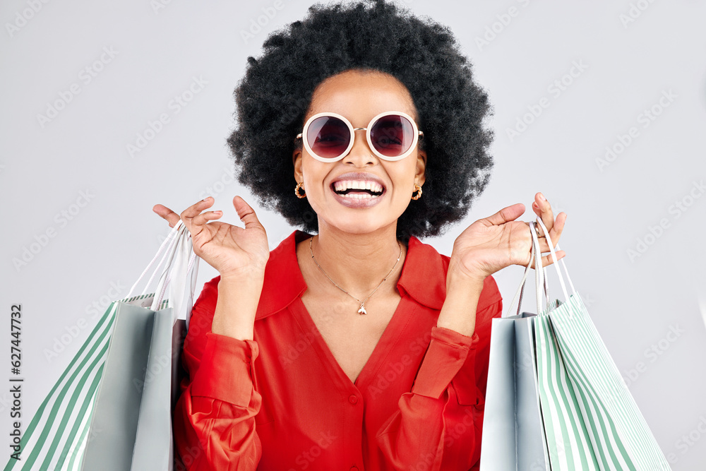 Happy black woman, face and shopping bags for fashion or style against a white studio background. Po