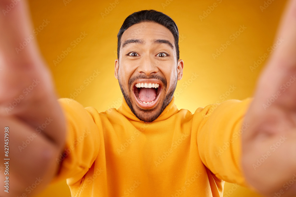 Excited, portrait and selfie of happy man in studio isolated on a yellow background. Face, smile and