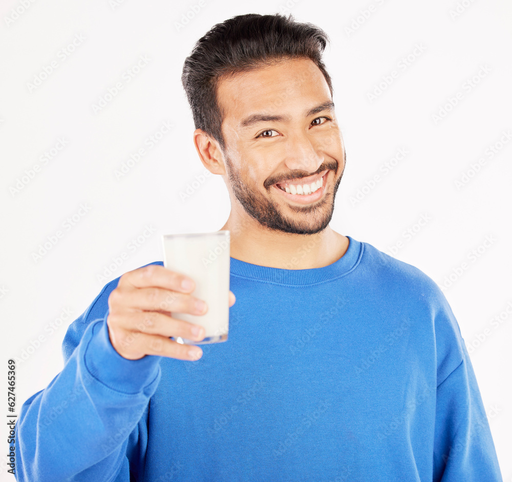 Portrait, man and smile with milk in studio, white background and backdrop for healthy benefits. Asi