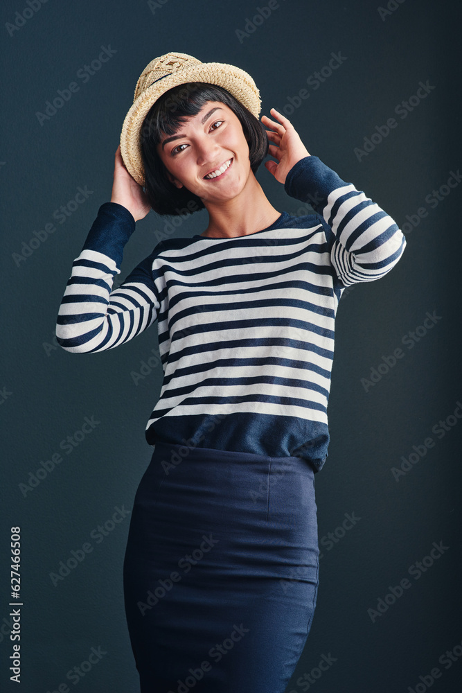 Be and do whatever makes you happy. Studio shot of an attractive young woman against a dark backgrou