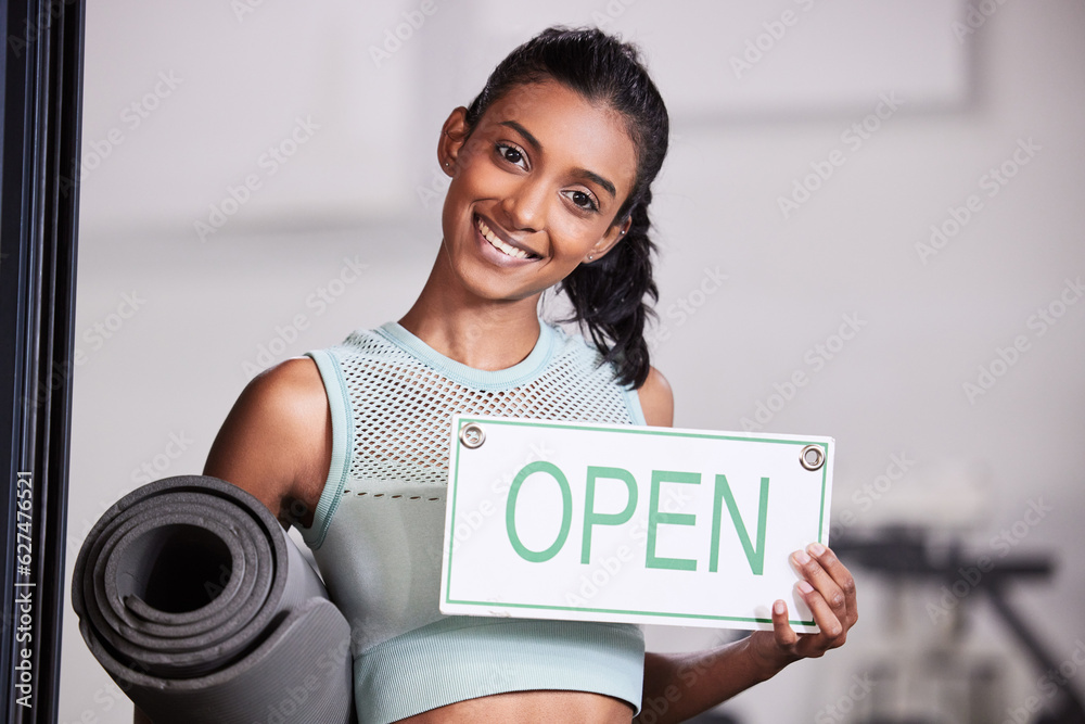 Happy girl, portrait or personal trainer at gym with an open sign for workout exercises or training.