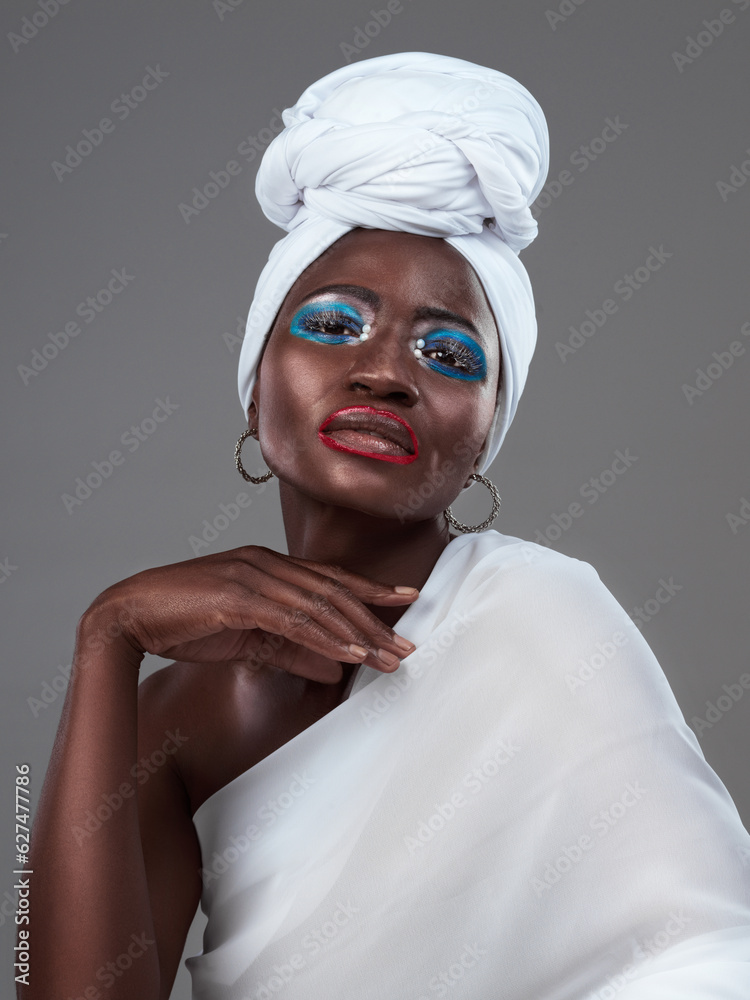 Striking African beauty. Studio portrait of an attractive young woman posing in traditional African 